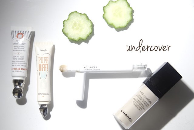 how to brighten up under eye circles picture of four different makeup products with two cucumber rounds