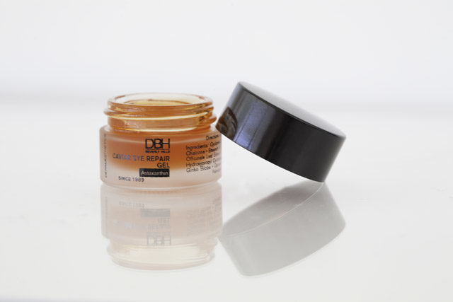 caviar eye gel pot with lid open showing orange gel product inside